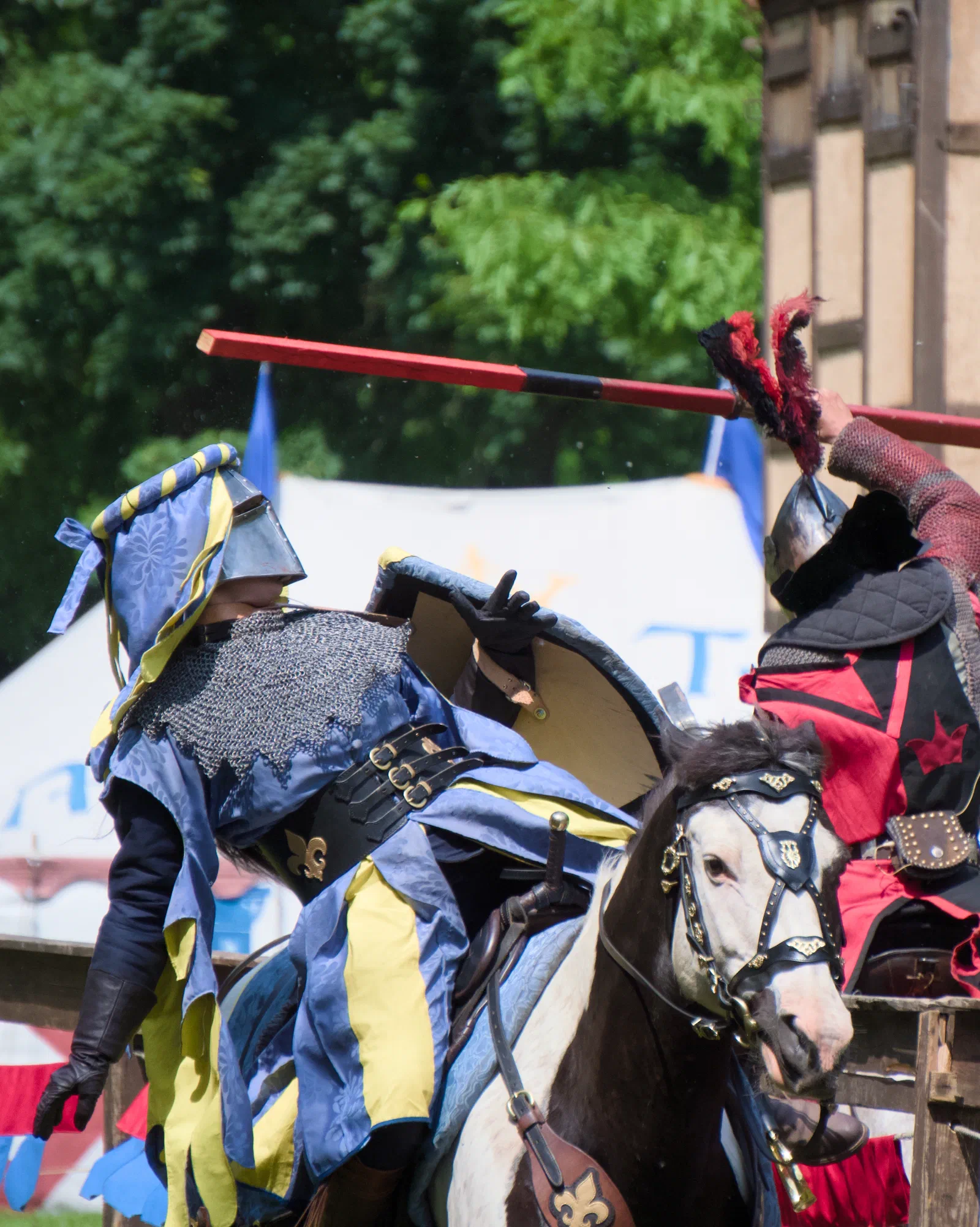 Two knights clashing on horseback with lances