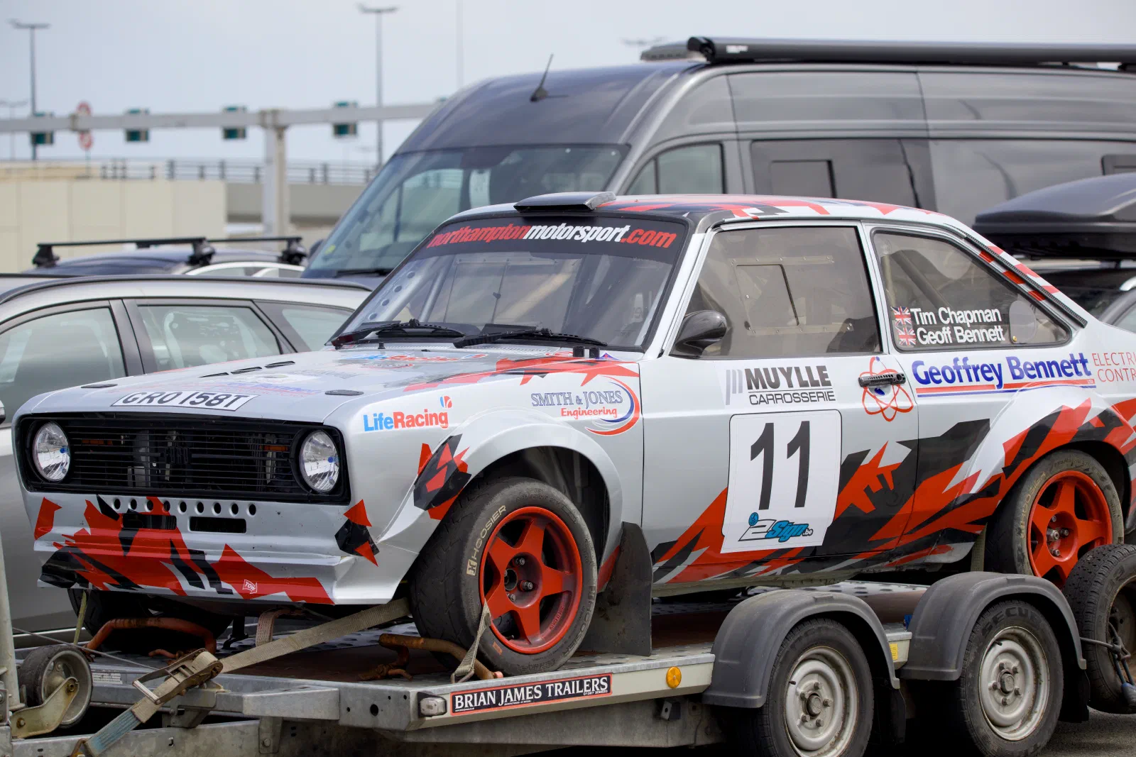 Classic Ford Escort rally car on a trailer in the ferry queue