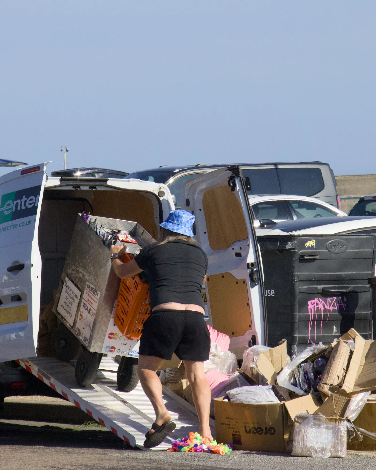 Street vendor loading his cart into a rental van