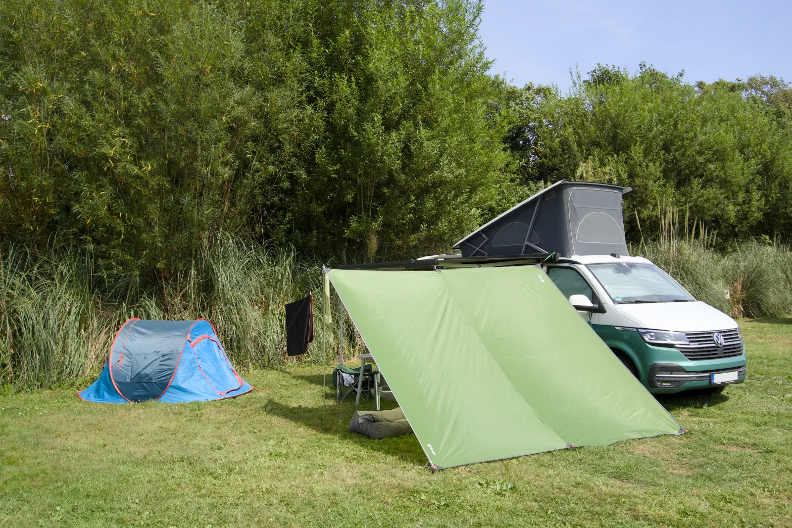 The California with the green awning tent and the blue pop-up tent on the pitch