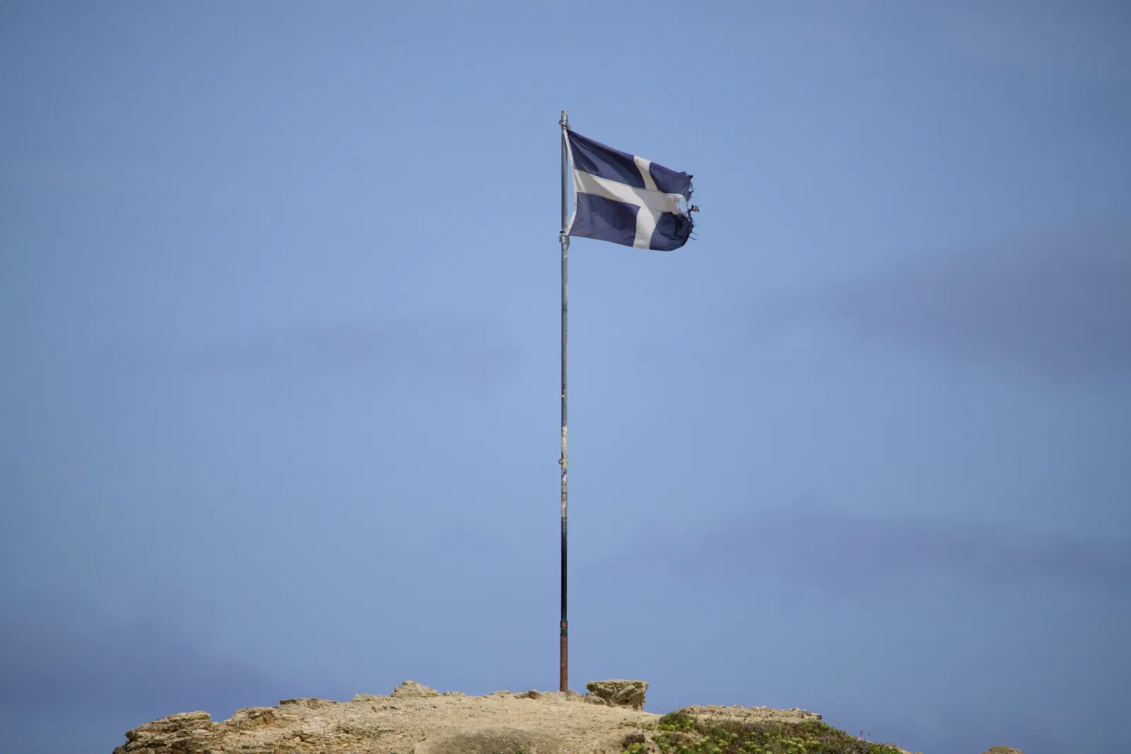 Cornish flag on a pole on top of the headland