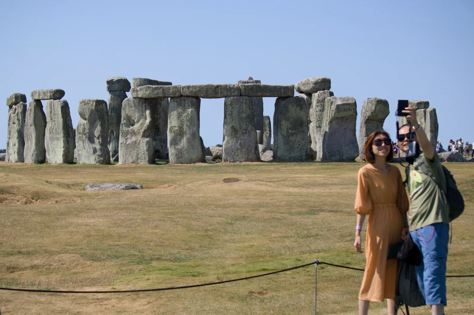 Couple taking a selfie in front of Stonehenge