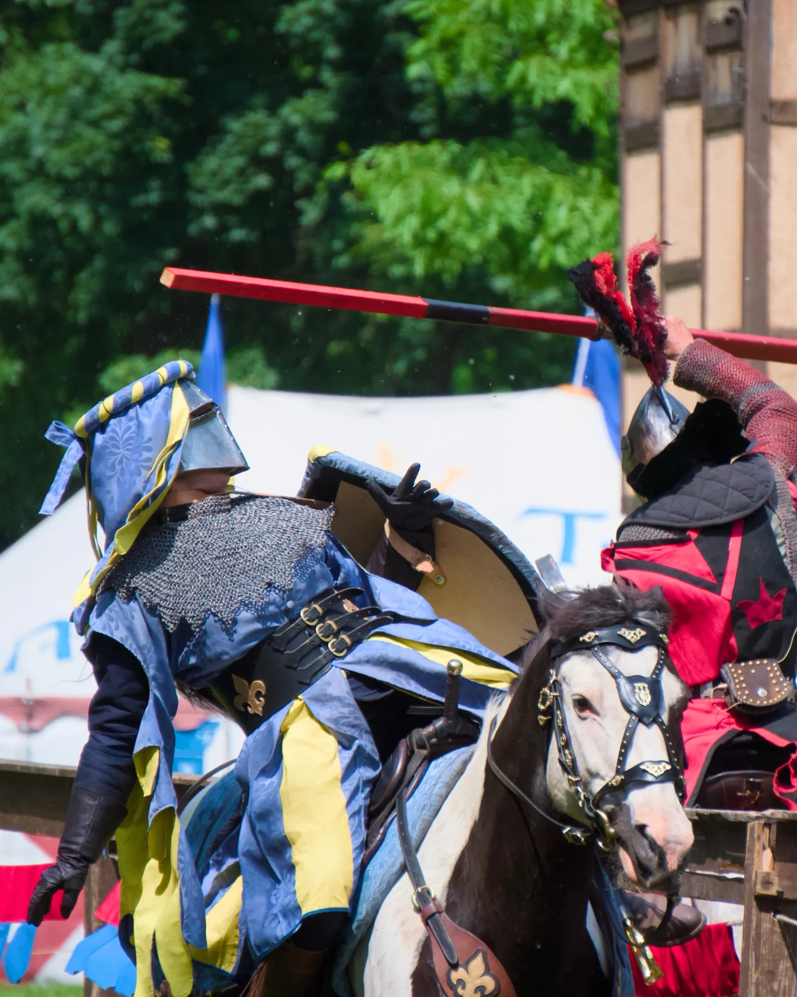 Two knights clashing on horseback with lances