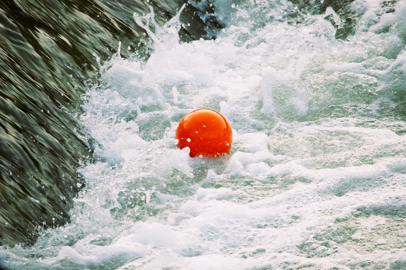 Orange ball trapped in the weir eddy