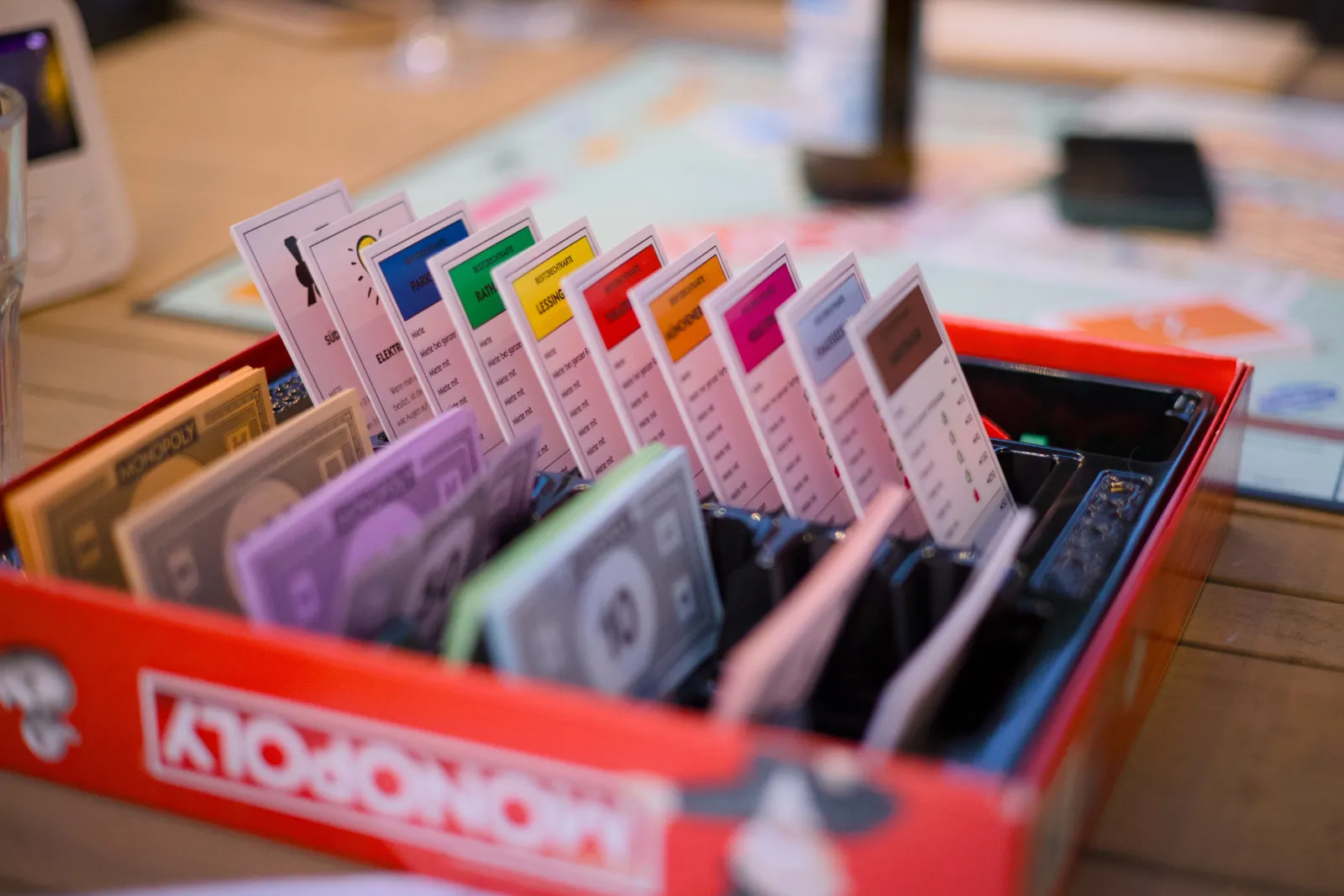 Monopoly box with property cards and play money