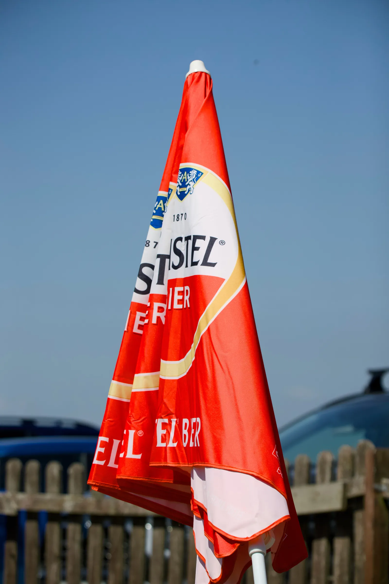 Folded Kastel Bier parasol against blue sky