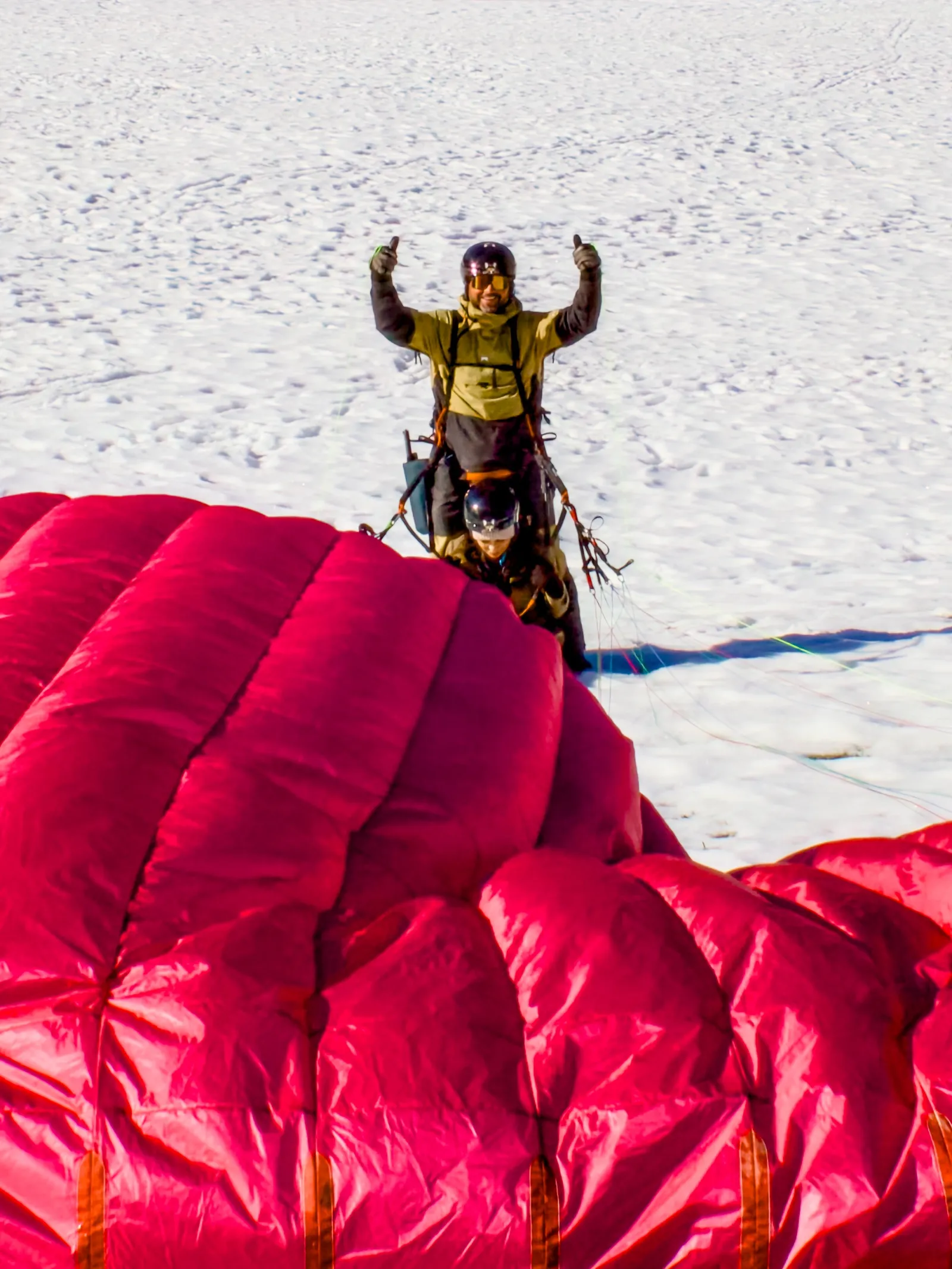 Tandem paraglider coming in to land