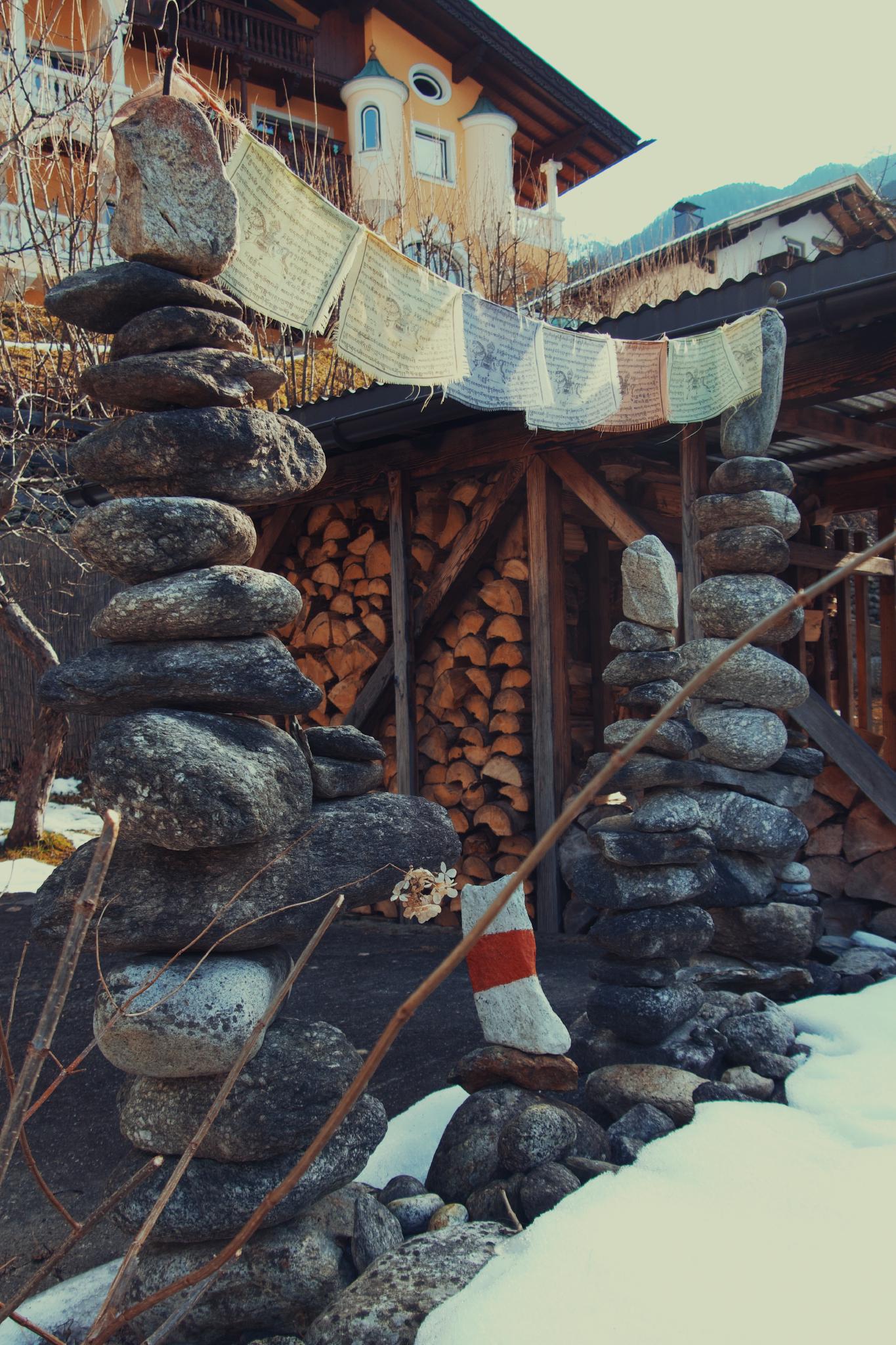 Stacked stone cairns with Tibetan prayer flags