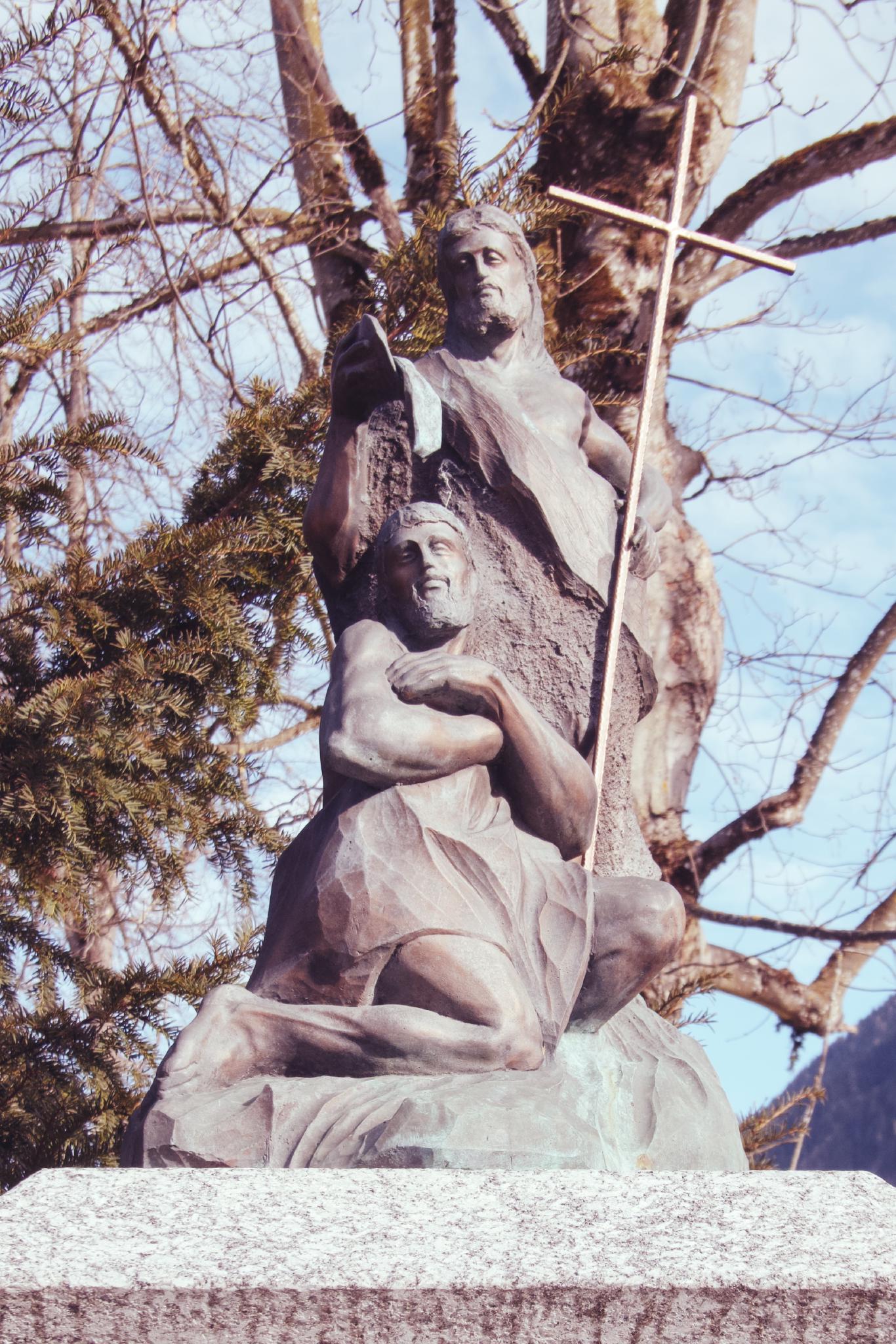 Statue against a blue sky