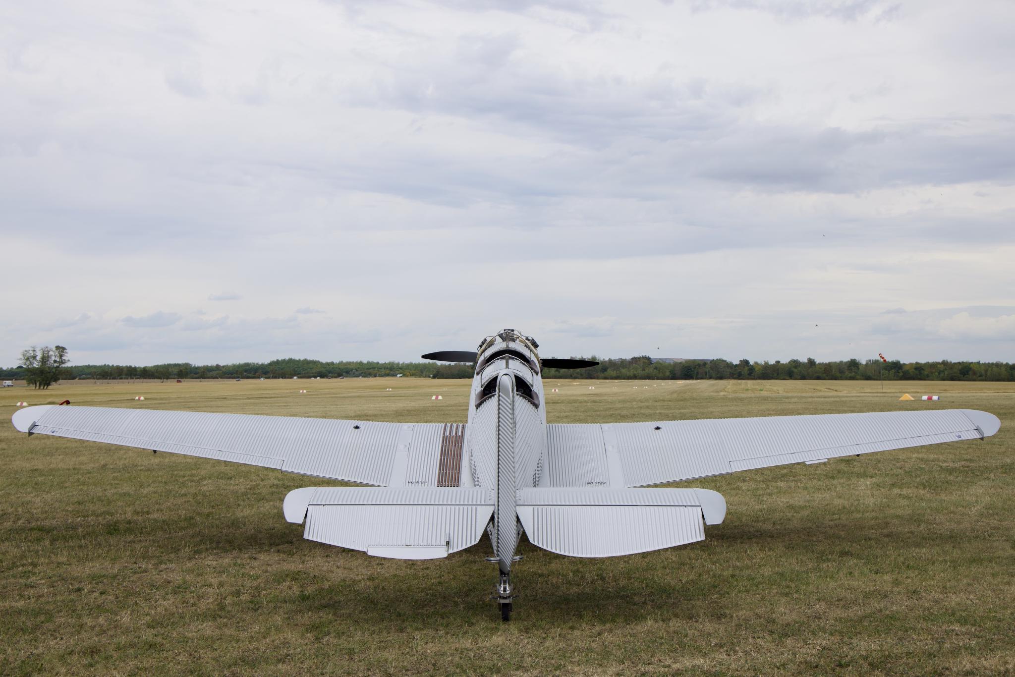 Junkers A50 Junior from behind on a grass airfield