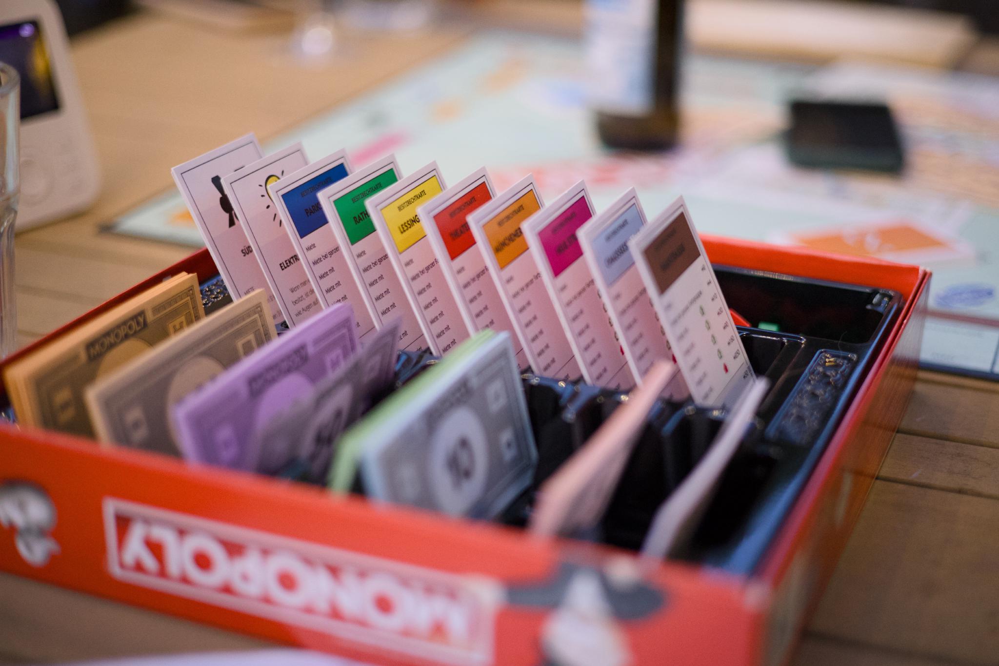 Monopoly box with property cards and play money