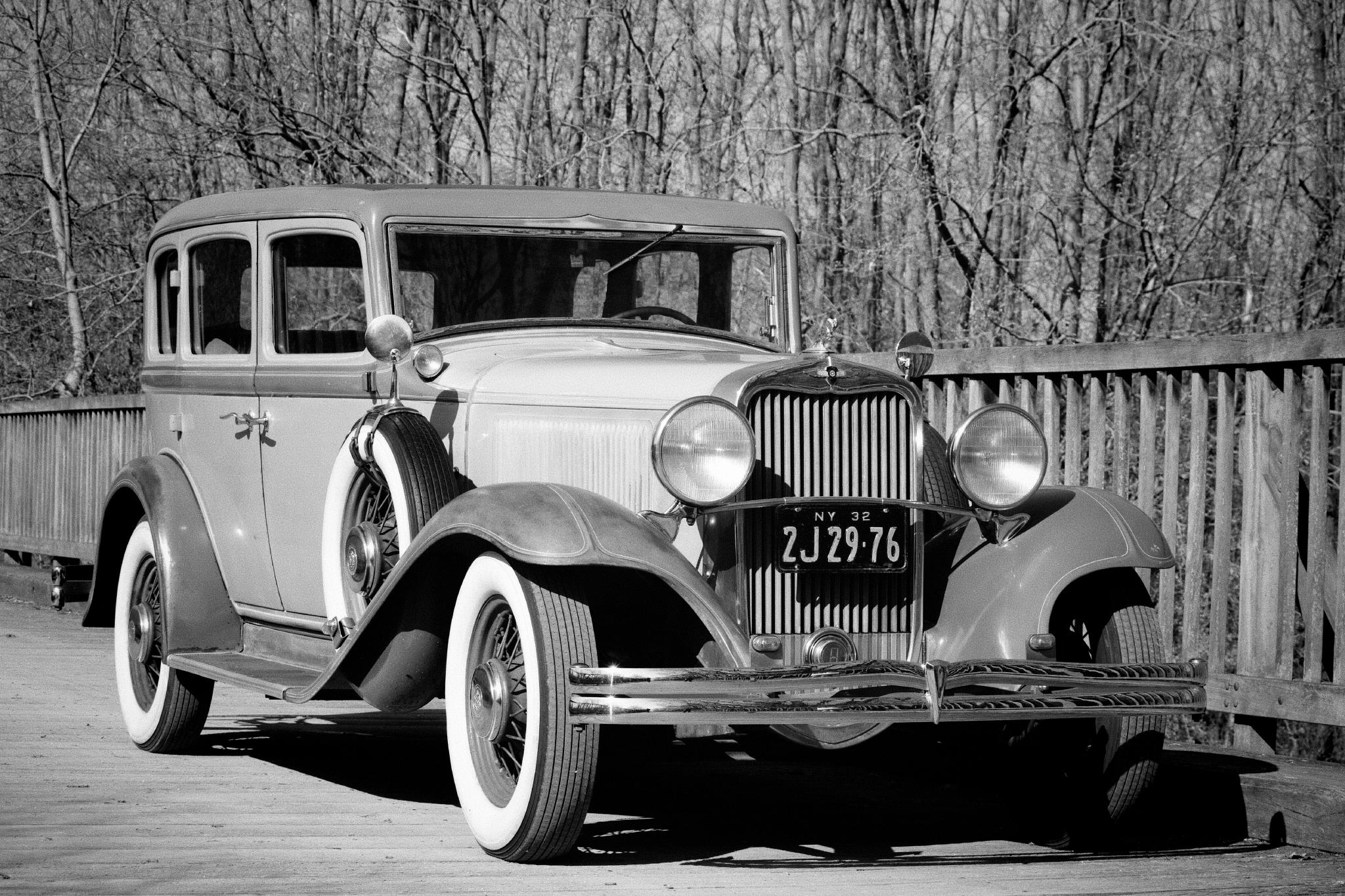 1932 Dodge Eight Series DK on a wooden bridge, front three-quarter view